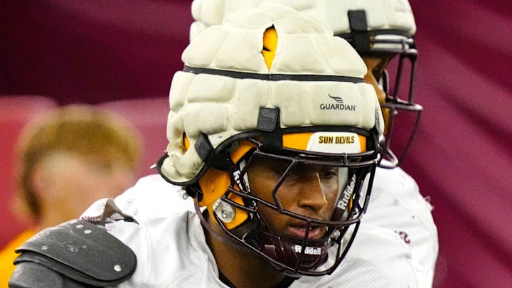 Arizona State linebacker Martell Hughes (18) warms up with his teammates during a practice inside the Verde Dickey Dome in Tempe on August 12, 2025.