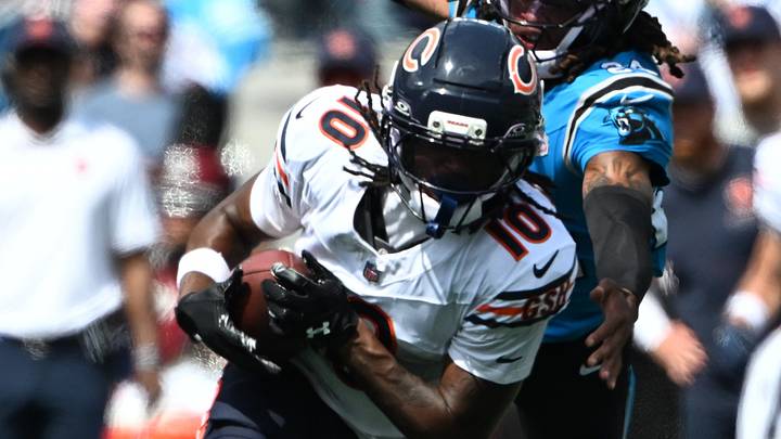 Sep 13, 2026; Charlotte, North Carolina, USA;  Chicago Bears wide receiver Luther Burden III (10) runs the ball while defended by Carolina Panthers cornerback Will Lee III (24) in the second quarter at Bank of America Stadium.  Mandatory Credit: Bob Donnan-Imagn Images