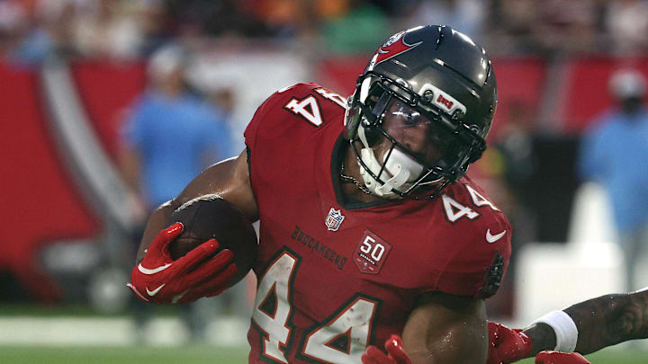 Tampa Bay Buccaneers running back Sean Tucker runs past Tennessee Titans cornerback Jalen Kimber. Tampa Bay Buccaneers running back Sean Tucker runs past Tennessee Titans cornerback Jalen Kimber.