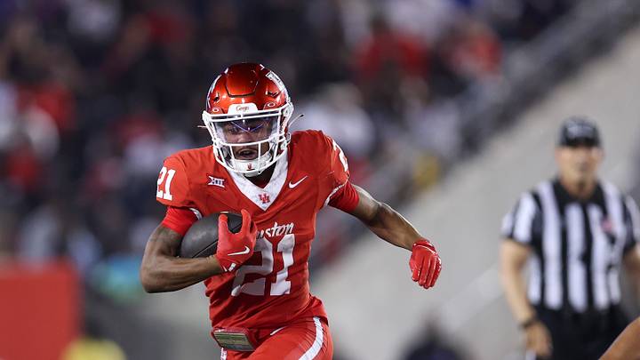 Sep 12, 2025; Houston, Texas, USA; Houston Cougars running back Stacy Sneed (21) runs with the ball during the third quarter against the Colorado Buffaloes at TDECU Stadium. Mandatory Credit: Troy Taormina-Imagn Images Sep 12, 2025; Houston, Texas, USA; Houston Cougars running back Stacy Sneed (21) runs with the ball during the third quarter against the Colorado Buffaloes at TDECU Stadium. Mandatory Credit: Troy Taormina-Imagn Images
