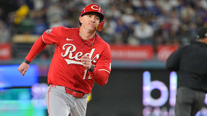 Sep 30, 2025; Los Angeles, California, USA; Cincinnati Reds left fielder Austin Hays (12) advances to third base on a single from Cincinnati Reds first baseman Spencer Steer (7) (not pictured) during the seventh inning against the Los Angeles Dodgers during game one of the Wildcard round for the 2025 MLB playoffs at Dodger Stadium. Mandatory Credit: Jayne Kamin-Oncea-Imagn Images