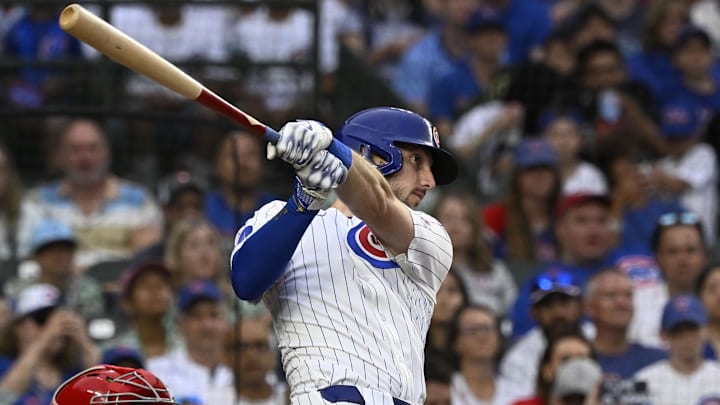 Jul 6, 2025; Chicago, Illinois, USA;  Chicago Cubs outfielder Kyle Tucker (30) hits a two RBI single against th St. Louis Cardinals during the third inning at Wrigley Field. Mandatory Credit: Matt Marton-Imagn Images