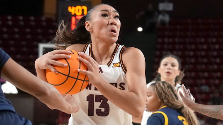 ASU Sun Devils guard Last-Tear Poa (13) drives into the lane as Coppin State Bald Eagles guard Skylar Barnes (5) defends at Desert Financial Arena on Nov. 3, 2025.