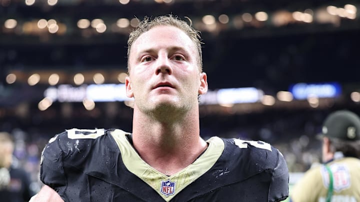 Oct 5, 2025; New Orleans, Louisiana, USA; New Orleans Saints linebacker Pete Werner (20) takes off his gloves as he walks off the field after their win against the New York Giants at Caesars Superdome. Mandatory Credit: Stephen Lew-Imagn Images