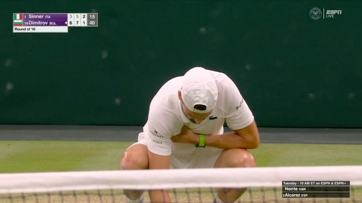 An injured Grigor Dimitrov clutches his chest in pain during his match vs. Jannik Sinner at Wimbledon on July 7, 2025.