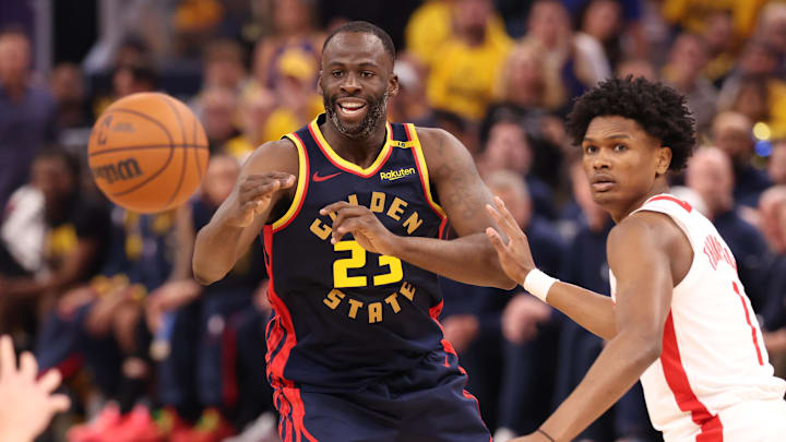 Apr 28, 2025; San Francisco, California, USA; Golden State Warriors forward Draymond Green (23) passes the ball against Houston Rockets forward/guard Amen Thompson (1) during the second quarter of game four of the 2025 NBA Playoffs first round at Chase Center. Mandatory Credit: Kelley L Cox-Imagn Images