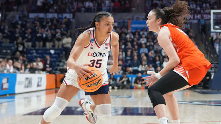 Mar 23, 2026; Storrs, CT, USA; UConn Huskies guard Azzi Fudd (35) dribbles the ball against Syracuse Orange guard Sophie Burrow (4) during the first half of the second round game of the women’s 2026 NCAA Tournament at Harry A. Gampel Pavilion. Mandatory Credit: Gregory Fisher-Imagn Images