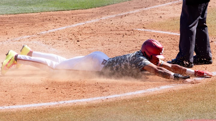 Alabama infielder Justin Lebron slides home in the eighth inning to put the Tide in the lead in the third game against Auburn on Mar. 29, 2026.
