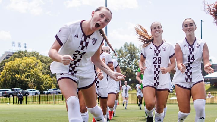 Mississippi State soccer players warm up before a game.