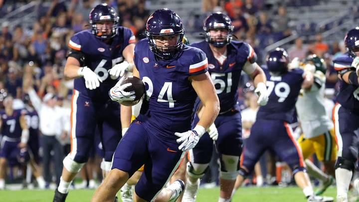 Sep 11, 2026; Charlottesville, Virginia, USA; Virginia Cavaliers tight end Hayden Rollison (94) runs after making a catch during the fourth quarter against the Norfolk State Spartans at Scott Stadium. Mandatory Credit: Amber Searls-Imagn Images Sep 11, 2026; Charlottesville, Virginia, USA; Virginia Cavaliers tight end Hayden Rollison (94) runs after making a catch during the fourth quarter against the Norfolk State Spartans at Scott Stadium. Mandatory Credit: Amber Searls-Imagn Images