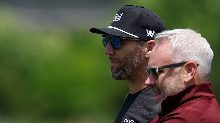 Jun 10, 2025; Ashburn, VA, USA; Washington Commanders general manager Adam Peters (L) and assistant general manager Lance Newmark (R) look on during day one of minicamp at Commanders Park. Mandatory Credit: Geoff Burke-Imagn Images Jun 10, 2025; Ashburn, VA, USA; Washington Commanders general manager Adam Peters (L) and assistant general manager Lance Newmark (R) look on during day one of minicamp at Commanders Park. Mandatory Credit: Geoff Burke-Imagn Images