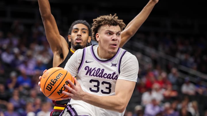 Mar 11, 2025; Kansas City, MO, USA; Kansas State Wildcats guard Coleman Hawkins (33) drives to the basket during the first half against the Arizona State Sun Devils at T-Mobile Center. Mandatory Credit: William Purnell-Imagn Images