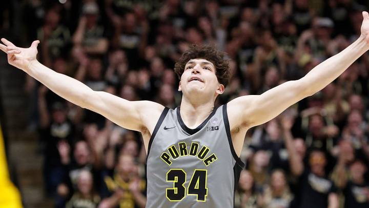 Purdue Boilermakers forward Raleigh Burgess (34) celebrates after scoring a basket. Purdue Boilermakers forward Raleigh Burgess (34) celebrates after scoring a basket.