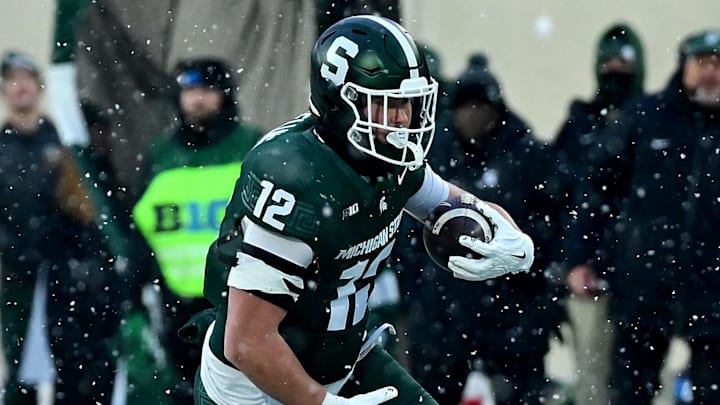 Nov 30, 2024; East Lansing, Michigan, USA;  Michigan State Spartans tight end Jack Velling (12) sprints upfield after catching a second quarter pass against the Rutgers Scarlet Knights at Spartan Stadium. Mandatory Credit: Dale Young-Imagn Images