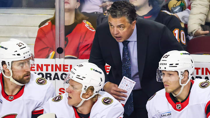 Mar 5, 2026; Calgary, Alberta, CAN; Ottawa Senators head coach Travis Green on his bench during the first period against the Calgary Flames at Scotiabank Saddledome. Mandatory Credit: Sergei Belski-Imagn Images