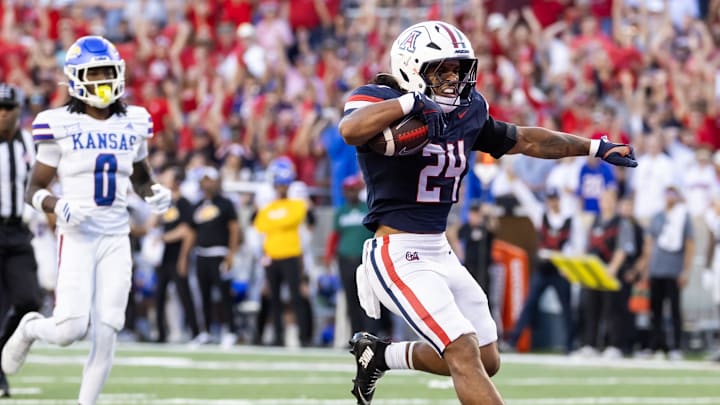 Nov 8, 2025; Tucson, Arizona, USA; Arizona Wildcats running back Quincy Craig (24) celebrates after rushing for a touchdown against the Kansas Jayhawks in the second half at Arizona Stadium. Mandatory Credit: Mark J. Rebilas-Imagn Images