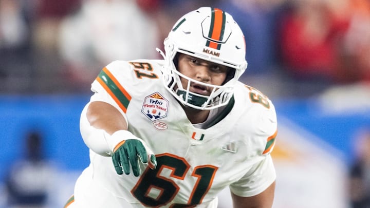 Jan 8, 2026; Glendale, AZ, USA; Miami Hurricanes offensive lineman Francis Mauigoa (61) against the Mississippi Rebels during the 2026 Fiesta Bowl and semifinal game of the College Football Playoff at State Farm Stadium. Mandatory Credit: Mark J. Rebilas-Imagn Images