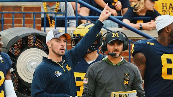 Connor Stalions signals from the sideline Connor Stalions signals from the sideline