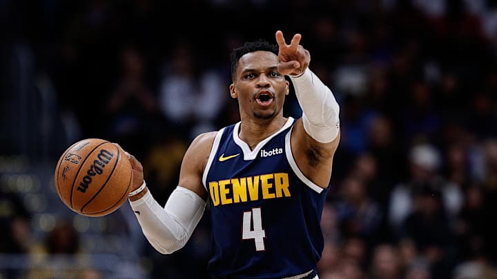 Apr 2, 2025; Denver, Colorado, USA; Denver Nuggets guard Russell Westbrook (4) gestures as he dribbles the ball up court in the third quarter against the San Antonio Spurs at Ball Arena. Mandatory Credit: Isaiah J. Downing-Imagn Images