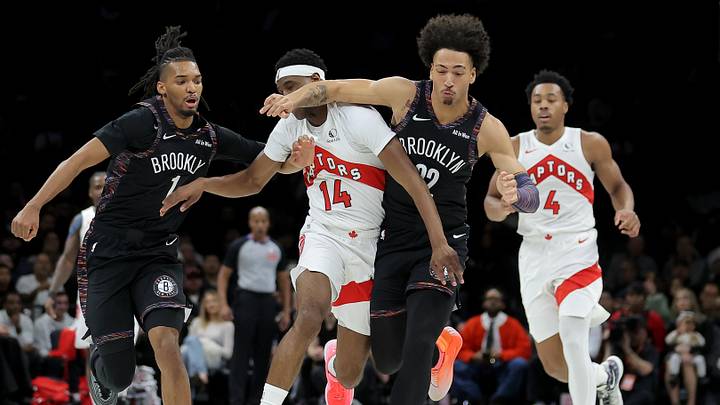 Nov 11, 2025; Brooklyn, New York, USA; Brooklyn Nets forwards Ziaire Williams (1) and Jalen Wilson (22) fight for a loose ball against Toronto Raptors guard Ja'Kobe Walter (14) and forward Scottie Barnes (4) during the first quarter at Barclays Center. Mandatory Credit: Brad Penner-Imagn Images