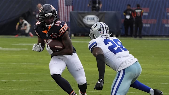 Sep 21, 2025; Chicago, Illinois, USA; Dallas Cowboys free safety Malik Hooker (28) tackles Chicago Bears wide receiver Luther Burden III (10) during the second half at Soldier Field. Mandatory Credit: David Banks-Imagn Images