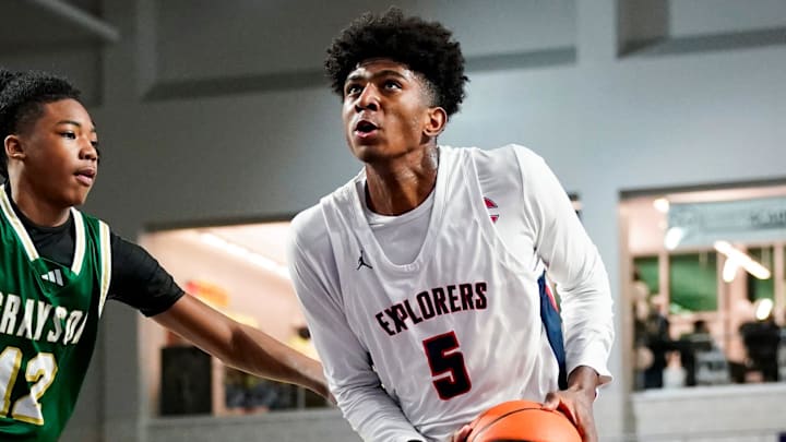Columbus Explorers guard Jaxon Richardson (5) drives to the basket as Grayson Rams guard Blaze Johnson (12) guards him during the third quarter of a City of Palms Classic quarterfinal game at Suncoast Credit Union Arena in Fort Myers, Fla., on Friday, Dec. 20, 2024.