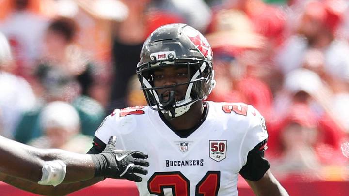 Tampa Bay Buccaneers cornerback Benjamin Morrison (21) celebrates a play with outside linebacker Lavonte David (54)