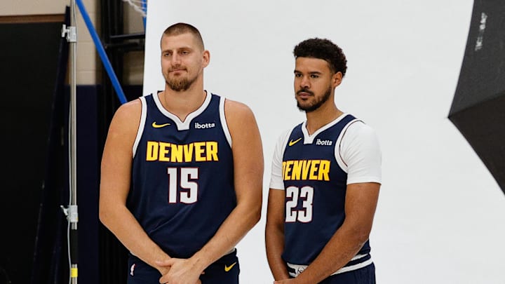 Sep 29, 2025; Denver, CO, USA; Denver Nuggets players Nikola Jokic (15) and Cam Johnson (23) pose for a picture during media day at Ball Arena. Mandatory Credit: Isaiah J. Downing-Imagn Images