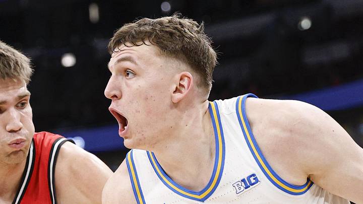 Mar 12, 2026; Chicago, IL, USA; UCLA Bruins forward Tyler Bilodeau (34) drives to the basket against Rutgers Scarlet Knights guard Harun Zrno (13) during the second half at United Center. Mandatory Credit: Kamil Krzaczynski-Imagn Images Mar 12, 2026; Chicago, IL, USA; UCLA Bruins forward Tyler Bilodeau (34) drives to the basket against Rutgers Scarlet Knights guard Harun Zrno (13) during the second half at United Center. Mandatory Credit: Kamil Krzaczynski-Imagn Images