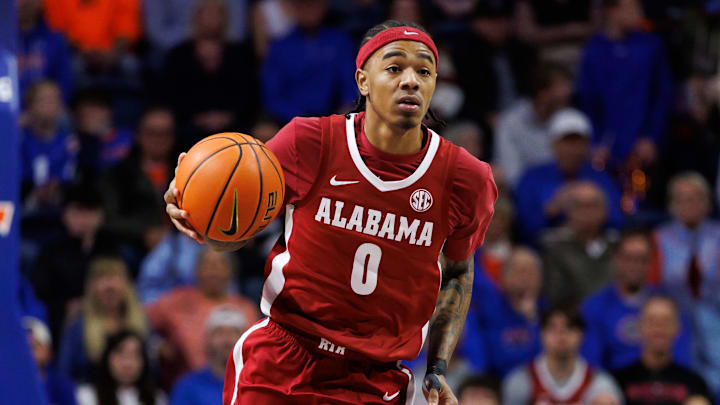 Feb 1, 2026; Gainesville, Florida, USA; Alabama Crimson Tide guard Labaron Philon (0) dribbles the ball against the Florida Gators during the first half at Exactech Arena at the Stephen C. O'Connell Center. Mandatory Credit: Matt Pendleton-Imagn Images