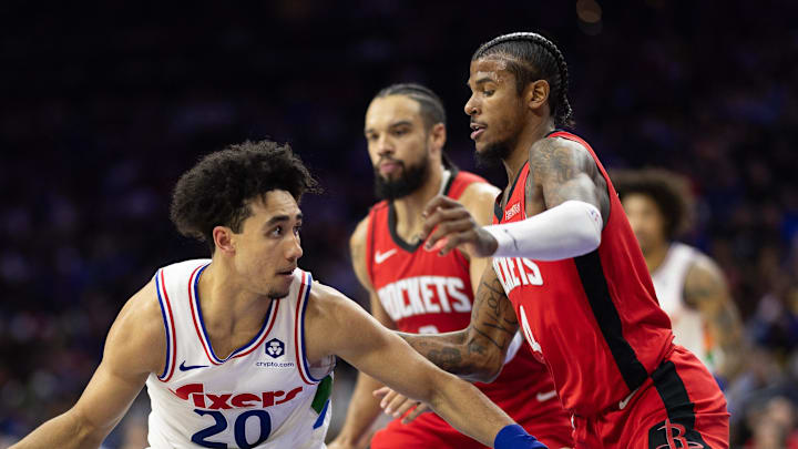 Nov 27, 2024; Philadelphia, Pennsylvania, USA; Philadelphia 76ers guard Jared McCain (20) controls the ball against Houston Rockets guard Jalen Green (4) during the second quarter at Wells Fargo Center. Mandatory Credit: Bill Streicher-Imagn Images