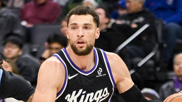 Feb 4, 2026; Sacramento, California, USA; Sacramento Kings guard Zach LaVine (8) dribbles past Memphis Grizzlies guard Kentavious Caldwell-Pope (3) during the third quarter at Golden 1 Center. Mandatory Credit: Ed Szczepanski-Imagn Images