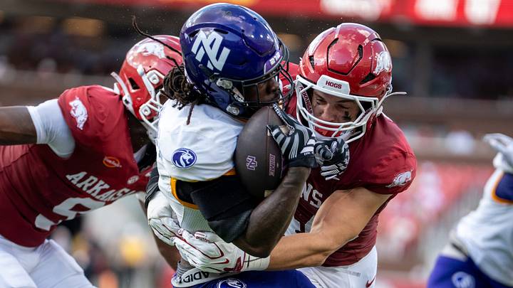 Arkansas Razorbacks linebacker Ben Bogle tackles a UNA offensive player during the season opener. Arkansas Razorbacks linebacker Ben Bogle tackles a UNA offensive player during the season opener.