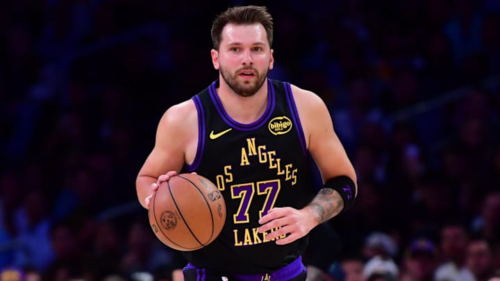 Mar 10, 2026; Los Angeles, California, USA; Los Angeles Lakers guard Luka Doncic (77) moves the ball up court against the Minnesota Timberwolves during the first half at Crypto.com Arena. Mandatory Credit: Gary A. Vasquez-Imagn Images