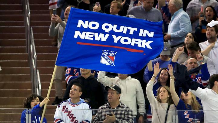 May 24, 2022; New York, New York, USA; New York Rangers fans wave a flag and celebrate a goal against the Carolina Hurricanes during the third period in game four of the second round of the 2022 Stanley Cup Playoffs at Madison Square Garden. May 24, 2022; New York, New York, USA; New York Rangers fans wave a flag and celebrate a goal against the Carolina Hurricanes during the third period in game four of the second round of the 2022 Stanley Cup Playoffs at Madison Square Garden.