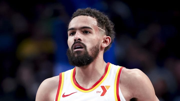 Trae Young #11 of the Atlanta Hawks dribbles the ball against the Dallas Mavericks.