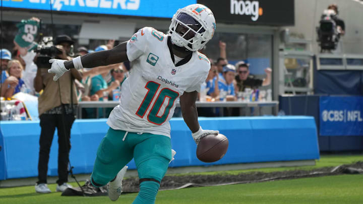 Sep 10, 2023; Inglewood, California, USA; Miami Dolphins wide receiver Tyreek Hill (10) celebrates after catching a 35-yard touchdown pass in the third quarter against the Miami Dolphins at SoFi Stadium. Mandatory Credit: Kirby Lee-Imagn Images