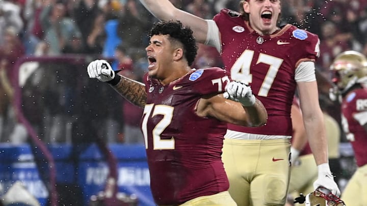 Dec 2, 2023; Charlotte, NC, USA; Florida State Seminoles offensive lineman Julian Armella (72) and tight end Jimmy Casey (47) celebrate winning the ACC Championship against the Louisville Cardinals at Bank of America Stadium. Mandatory Credit: Bob Donnan-Imagn Images