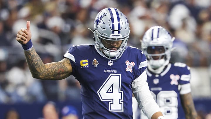 Dallas Cowboys quarterback Dak Prescott signals towards the sideline following a play against the Los Angeles Chargers