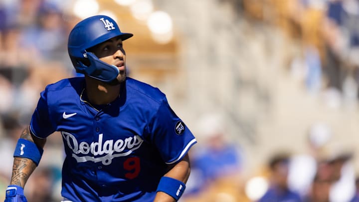 Feb 20, 2025; Phoenix, Arizona, USA; Los Angeles Dodgers outfielder Eddie Rosario rounds the bases after hitting a two run home run against the Chicago Cubs during a spring training game at Camelback Ranch-Glendale.