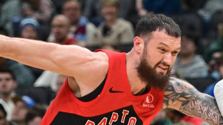 Milwaukee Bucks guard Kevin Porter Jr. drives for the basket against Toronto Raptors forward Sandro Mamukelashvili.