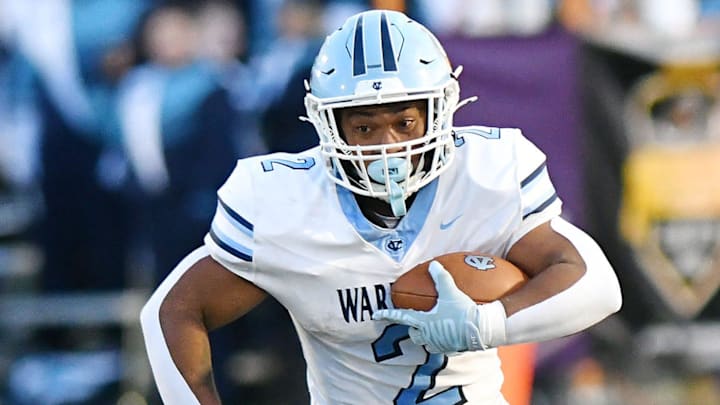 Central Valley’s Jance Henry carries the ball during Friday night’s game at Montour High School.