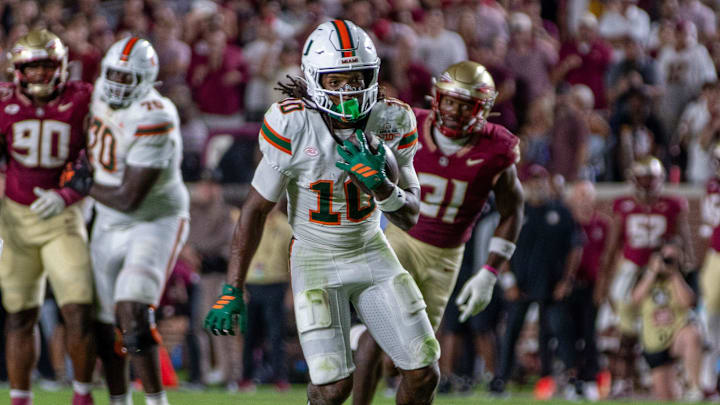 University of Miami wide receiver Malachi Toney (10) runs after catching a pass from quarterback Carson Beck (11). University of Miami wide receiver Malachi Toney (10) runs after catching a pass from quarterback Carson Beck (11).