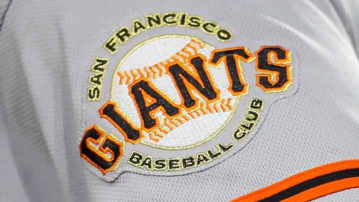 The San Francisco Giants logo on the sleeve of a player during a game. 