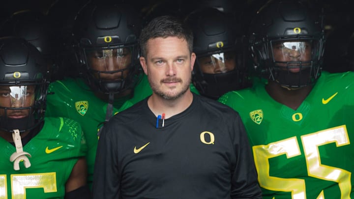 Oregon coach Dan Lanning leads his team onto the field before the game against Colorado in Eugene Saturday, Sept. 23, 2023.