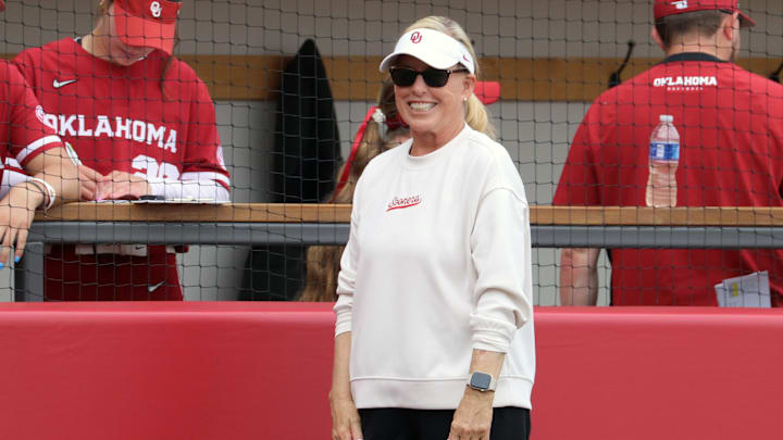 Oklahoma coach Patty Gasso smiles outside the dugout at Love's Field.