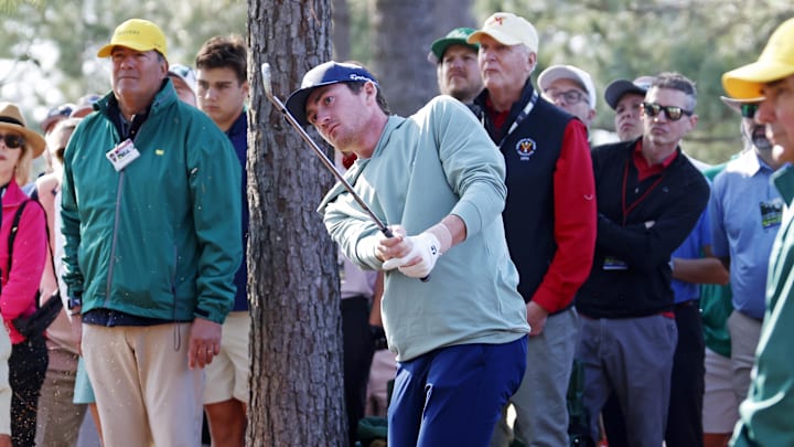 Nick Dunlap hits a shot at the Masters.