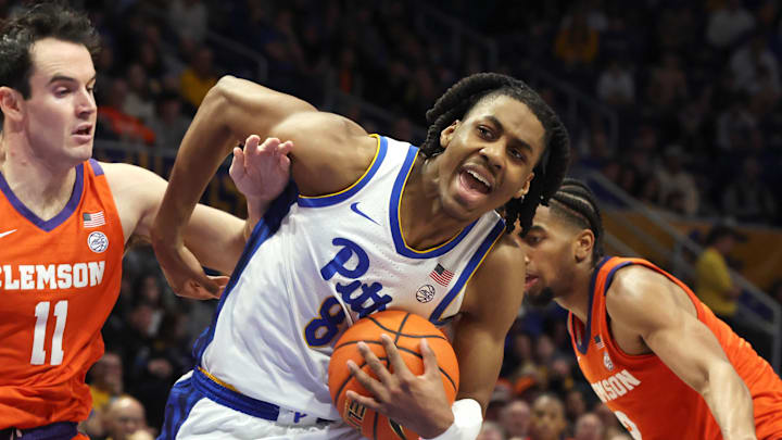 Jan 3, 2026; Pittsburgh, Pennsylvania, USA;  Clemson Tigers forward Nick Davidson (11) defends Pittsburgh Panthers guard Omari Witherspoon (8) going to the basket during the second half at the Petersen Events Center. Mandatory Credit: Charles LeClaire-Imagn Images