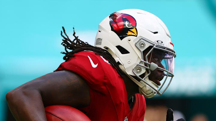 Oct 27, 2024; Miami Gardens, Florida, USA; Arizona Cardinals running back DeeJay Dallas (20) runs with the football against the Miami Dolphins during the third quarter at Hard Rock Stadium. Mandatory Credit: Sam Navarro-Imagn Images