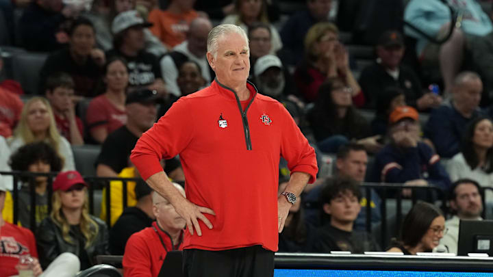 Nov 24, 2025; Las Vegas, Nevada, USA; San Diego State Aztecs head coach Brian Dutcher looks on during the first half against the Michigan Wolverines in a 2025 Players Era Festival group play game at Michelob Ultra Arena.